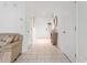 Inviting entryway with tiled floor, decorative mirror and access to living areas at 8415 Edgewater Place Blvd, Tampa, FL 33615