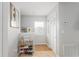 Inviting entryway featuring a shoe rack and decor, complemented by natural light from the window at 8415 Edgewater Place Blvd, Tampa, FL 33615