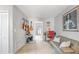 Hallway showcasing a home office/music room and light gray walls at 8415 Edgewater Place Blvd, Tampa, FL 33615