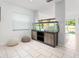 Cozy area with a large fish tank, tile floors, and a view of the outdoors at 8415 Edgewater Place Blvd, Tampa, FL 33615