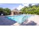 Community pool featuring a covered pavilion and poolside seating, perfect for relaxation at 8415 Edgewater Place Blvd, Tampa, FL 33615