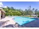Sparkling community pool with ample seating and lush landscaping creating a resort-like atmosphere at 8415 Edgewater Place Blvd, Tampa, FL 33615