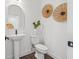 Well-lit half-bathroom with a modern sink and stylish wall decor, adding a touch of elegance at 851 6Th S Ave, St Petersburg, FL 33701