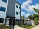 Modern two-story home featuring a fenced front yard and sleek architectural design at 851 6Th S Ave, St Petersburg, FL 33701