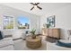 Sunlit living room showcasing comfortable seating, stylish decor, and a bright, airy ambiance at 851 6Th S Ave, St Petersburg, FL 33701