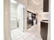 Bright kitchen with stainless appliances, granite counters, and laundry room access at 9191 64Th N Way, Pinellas Park, FL 33782