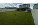 Wide shot of backyard with pergola and outdoor dining, perfect for outdoor living at 9520 Lemon Drop Loop, Sun City Center, FL 33573
