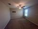 Neutral bedroom with carpet, ceiling fan, window and contemporary decor at 9520 Lemon Drop Loop, Sun City Center, FL 33573
