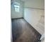 A walk-in closet featuring shelving and a window allowing natural light at 9520 Lemon Drop Loop, Sun City Center, FL 33573