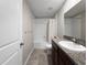 Bathroom features a shower-tub combination, granite vanity, and tile flooring at 9605 Channing Hill Dr, Sun City Center, FL 33573