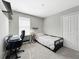 Bedroom features carpet floors, a large closet and a workspace with a desk at 9605 Channing Hill Dr, Sun City Center, FL 33573