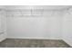 Empty closet with gray carpet and wire shelving, ready for storage solutions at 9605 Channing Hill Dr, Sun City Center, FL 33573
