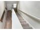 Inviting entryway with staircase, coat rack, and tile flooring, offering a welcoming start to this home at 9605 Channing Hill Dr, Sun City Center, FL 33573