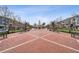 Community plaza featuring manicured landscaping and sidewalks flanked by townhomes, with a clock tower in distance at 10516 Gretna Green Dr, Tampa, FL 33626