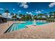 Large community pool surrounded by lush landscaping, offering a relaxing recreational space at 10516 Gretna Green Dr, Tampa, FL 33626