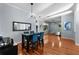 Dining room boasting hardwood floors, modern lighting, stylish decor, and an open layout at 10516 Gretna Green Dr, Tampa, FL 33626