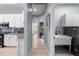 Hallway view includes a kitchen, bathroom and a laundry area with modern washer and sink at 10516 Gretna Green Dr, Tampa, FL 33626