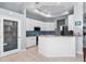 Bright kitchen features white cabinetry, granite countertops, and stainless steel appliances at 10516 Gretna Green Dr, Tampa, FL 33626