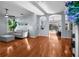 Bright and spacious living room with hardwood floors and a stylish gray sofa at 10516 Gretna Green Dr, Tampa, FL 33626