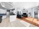 Open-concept living space with kitchen, living room, and dining area featuring hardwood and tile floors at 10516 Gretna Green Dr, Tampa, FL 33626