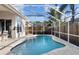 A refreshing pool is enclosed and is surrounded by a stone patio at 10516 Gretna Green Dr, Tampa, FL 33626