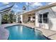 Relaxing screened pool with a clear blue water and a spacious patio area at 10516 Gretna Green Dr, Tampa, FL 33626
