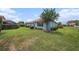 Spacious backyard with lush green lawn and well-maintained landscaping at 10645 Ruffino Ct, Trinity, FL 34655