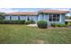 Charming single-story home with a terra cotta roof, tidy landscaping, and well-maintained green lawn at 10645 Ruffino Ct, Trinity, FL 34655