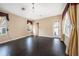 Spacious living room with dark hardwood floors and plenty of natural light at 10645 Ruffino Ct, Trinity, FL 34655