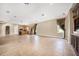 Expansive living space with tile flooring and large windows offering ample light and open access to the kitchen at 10645 Ruffino Ct, Trinity, FL 34655