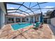 Relaxing pool and spa in a screened enclosure offer an ideal outdoor experience at 10645 Ruffino Ct, Trinity, FL 34655
