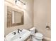 Stylish powder room features mosaic mirror, bronze faucet, and pedestal sink at 10645 Ruffino Ct, Trinity, FL 34655