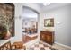 Elegant foyer with decorative flooring, arched doorways, and a view into the dining room at 10709 Rockledge View Dr, Riverview, FL 33579