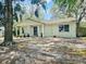 Charming single-story home with a well-maintained lawn and mature trees at 10932 N 21St St, Tampa, FL 33612