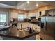 Spacious kitchen with white cabinets, stainless steel appliances, and a breakfast bar at 10932 N 21St St, Tampa, FL 33612