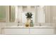 Bathroom featuring double sink vanity with granite countertop, and bright lighting at 11083 E 65Th Ter, Palmetto, FL 34221