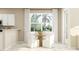 Bright dining area features a modern table, white chairs, and a large window view at 11083 E 65Th Ter, Palmetto, FL 34221