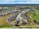 An aerial shot of a community showcasing landscaped homes lining the golf course with picturesque ponds and fairways at 1110 Jasmine Creek Ct, Sun City Center, FL 33573