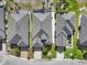 An aerial view showcases the homes, their unique rooflines, and landscaping creating a visually appealing neighborhood at 1110 Jasmine Creek Ct, Sun City Center, FL 33573
