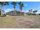 Enjoy a backyard oasis, screened lanai, and mature palm trees adding to the property's charm at 1110 Jasmine Creek Ct, Sun City Center, FL 33573