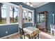 Charming breakfast nook with natural light, a decorative display cabinet, and views of the landscape at 1110 Jasmine Creek Ct, Sun City Center, FL 33573