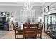 Elegant dining room featuring a modern chandelier and ample seating at 1110 Jasmine Creek Ct, Sun City Center, FL 33573