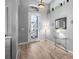 Welcoming entryway with light wood flooring, high ceilings, and decorative mirror at 1110 Jasmine Creek Ct, Sun City Center, FL 33573