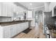 Large kitchen with granite countertops, stainless appliances, abundant storage, and seamless flow to the dining area at 1110 Jasmine Creek Ct, Sun City Center, FL 33573