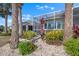 Backyard landscaping with tropical plants and an enclosed patio at 1110 Jasmine Creek Ct, Sun City Center, FL 33573
