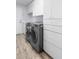 Laundry area with cabinets and counterspace plus washer and dryer hookups at 1110 Jasmine Creek Ct, Sun City Center, FL 33573