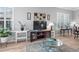 Bright living area showcasing a media center, side tables, and a decorative area rug for a cozy atmosphere at 1110 Jasmine Creek Ct, Sun City Center, FL 33573