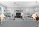 Comfortable living room with a large sofa, modern TV, and stylish decorations at 1110 Jasmine Creek Ct, Sun City Center, FL 33573