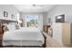 Main bedroom with natural light, ceiling fan, and sliding glass door to exterior at 1110 Jasmine Creek Ct, Sun City Center, FL 33573