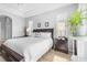 Main bedroom with natural light, ceiling fan, and hard surface floors at 1110 Jasmine Creek Ct, Sun City Center, FL 33573